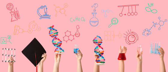 Female hands holding DNA model with filled flask, test tubes and measuring cup on pink background. Chemistry lesson concept