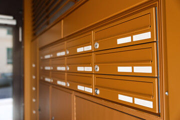 Brown mailboxes in residential building