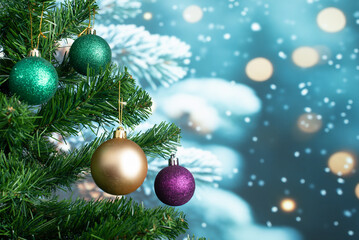 Christmas tree decoration balls with snowy bokeh background and copy space