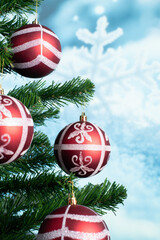 Christmas tree decoration balls with snowy bokeh background and copy space