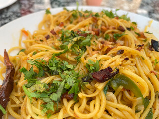 Noodles served in a plate, also known as chowmein.