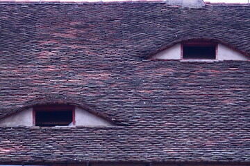Eyes watching from the roof of the house, Sibiu, Transylvania, Romania