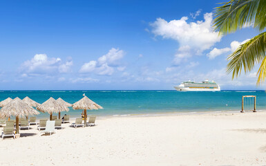 View from tropical beach on cruise ship sailing from port 