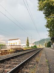 A train track with a building in the background