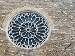 Trieste, Italy - June 27, 2024: Trieste, Italy - June 27, 2024: Cattedrale di San Giusto Martire, Cathedral at San Giusto castle. Outside front wall with closeup of gothic style rose window