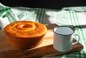 Orange cake, a beautiful sunny breakfast table and delicious Orange cake, selective focus.