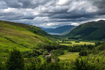 Obraz premium Corrieshalloch Gorge National Nature Reserve With River Through Pasture Valley And Loch Broom In Scotland, UK