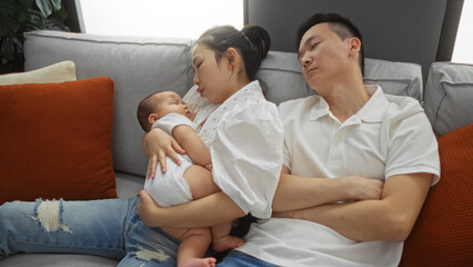 Mother and father sleeping with baby in cozy apartment living room, showcasing love and family bonding in an indoor setting, highlighting tender moments of togetherness.