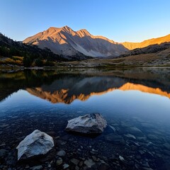 Fototapeta premium A calm clear mountain lake reflecting the colors