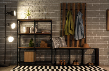 Interior of hall with glowing lamp, coat rack and shelves in evening © Pixel-Shot