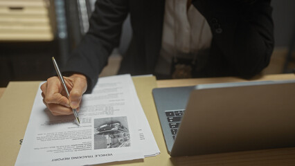 A woman detective analyzes evidence in an office, with a laptop, documents, pen, investigation, surveillance photo, and case files.