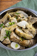 Italian food, pickled grilled artichokes hearts in olive oil close up