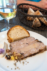 Terrine foie gras fat liver specialty food product made of liver of a duck or goose fattened by force feeding, served in French restaurant in Perigoed, Dordogne, close up