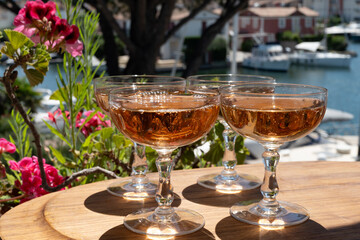 Summer party, French brut rose champagne sparkling wine in coupe glasses in yacht harbour of Port Grimaud near Saint-Tropez, French Riviera vacation, Var, France
