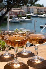 Summer party, French brut rose champagne sparkling wine in coupe glasses in yacht harbour of Port Grimaud near Saint-Tropez, French Riviera vacation, Var, France