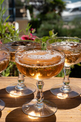Summer party, French brut rose champagne sparkling wine in coupe glasses in yacht harbour of Port Grimaud near Saint-Tropez, French Riviera vacation, Var, France