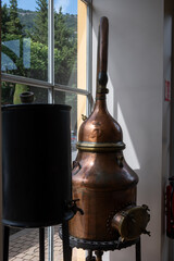 Copper distillation tanks, classic perfume production from natural ingredients in Provence, perfume factory in Grass or Eze, French riviera