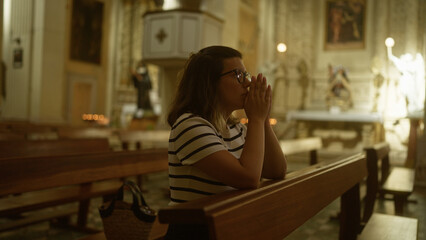 A young hispanic woman praying in a historic christian church in italy, surrounded by serene, spiritual, and sacred church interior.