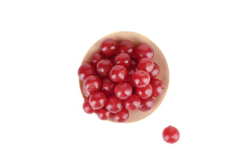 Top view of ripe viburnum berries on serving plate and white background.