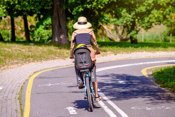Fototapeta premium Cyclist ride on the bike path in the city Park 
