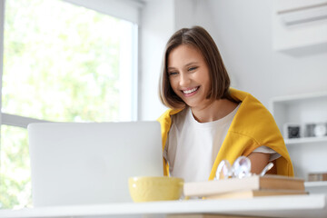 Teenage girl filling out college application form at home