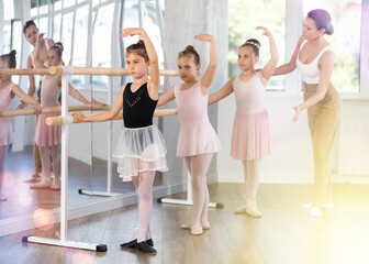 Fourth position - little girls learn ballet at a choreography lesson © JackF