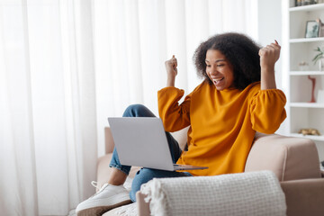 Online Win. Excited African American Lady Celebrating Success With Laptop At Home, Cheerful Young...