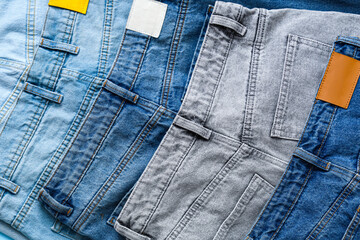 Set of stylish jeans pants, closeup