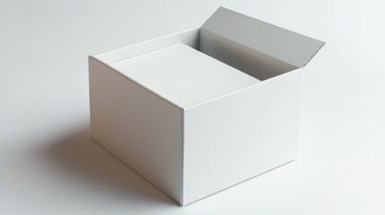 A sturdy white cardboard box with flaps slightly open, placed at an angle on a smooth white surface 