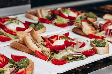 Close up of Italian panini with vegetables and mozzarella