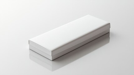 A thin, sleek white box with a hinged lid, lying flat on a glossy white surface 