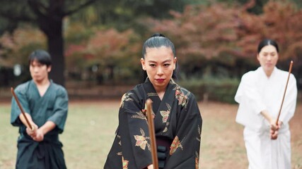 Bamboo, Kendo and sword with Japanese Sensei in forest for martial arts exercise, technique or training. Class, culture or fitness and Samurai group in nature for practice or skill with instructor