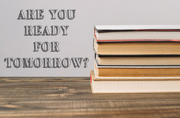 A stack of books with the words Are you ready for tomorrow written on top
