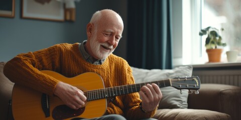 Obraz premium An elderly man joyfully playing guitar at home, wearing a cozy sweater. This intimate scene captures the warmth of music and happiness in everyday life. A perfect image for lifestyle themes. AI