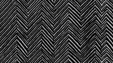 A seamless black-and-white herringbone pattern on a modern fabric texture.