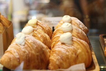 display of croissants for sale at coffee shop