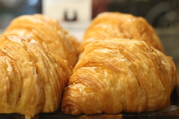 display of croissants for sale at coffee shop