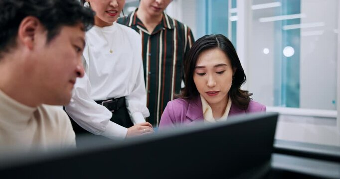 Japanese, business people and teamwork with computer in office as software engineer for web agency. Group, ideas and technology in coworking for planning, discussion and collaboration in presentation