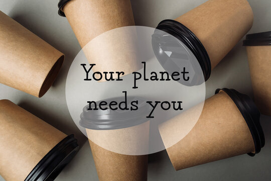 Pile of coffee cups with the words Your planet needs you written on them - Powered by Adobe