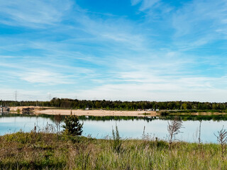 A beautiful lake with a clear blue sky above it