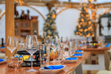 Rustic winter wonderland: wooden tables, cozy fur throws, Christmas trees and festive touches await diners at a restaurant in Zurich, Switzerland