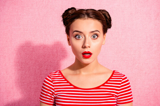 Close up photo beautiful she her lady pretty two buns unexpected news big eyes opened mouth speechless oh no face bright pomade lipstick wear casual striped red white t-shirt isolated pink background