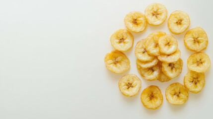 Freshly Dried Banana Chips Arranged Artfully on a Light Background Highlighting Their Natural Sweetness and Crunchy Texture Perfect for Healthy Snacking or Cooking