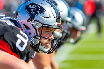 Football American offensive line forming a pocket, protecting the quarterback as he surveys the field for a pass
