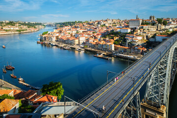 View of Porto city and Douro river and Dom Luis bridge I from famous tourist viewpoint Miradouro da Serra do Pilar on sunset. Porto, Vila Nova de Gaia, Portugal