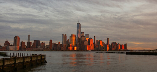 Fototapeta premium Manhattan skyline with WTC. Financial District NYC. Twin Towers memorial. World Trade Center over Hudson river.
