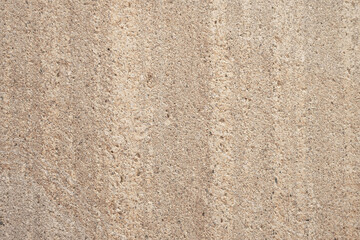 Close up detail of beige rough concrete wall texture. Design element use for background or backdrop in architecture and construction concept