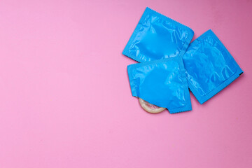 Flat Lay of Wrapped Condoms Isolated on Pink Background