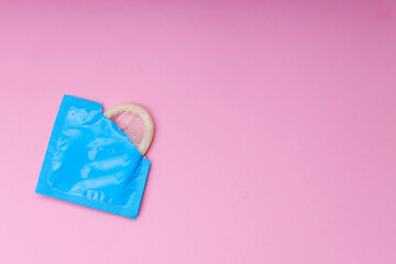 High Angle of Opened Condom Ready To Use Isolated on Pink Background