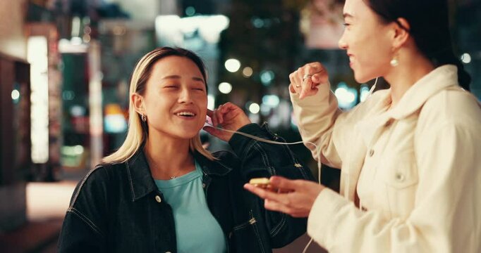 Japanese, smartphone and women listening to music, sound and dancing in city. Friends, outdoor and Asian people with radio, song and energy with movement, bonding together and happiness with joy